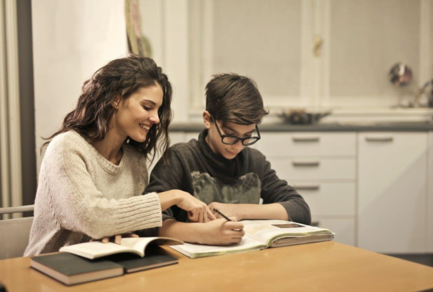 Sister and brother studying at home